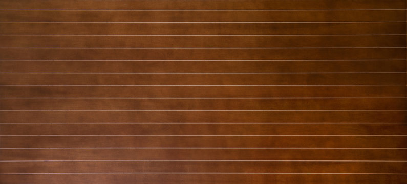 Brown wood panel texture with parallel lines