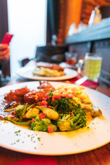 Braised rabbit in dark beer with mashed potatoes and steamed vegetables. National Belgian cuisine