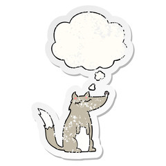 cartoon wolf and thought bubble as a distressed worn sticker