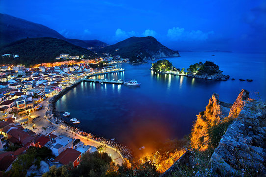 Panoramic night view of Parga town and the islet of Panagia from the Venetian castle of the town, Preveza prefecture, Epirus, Greece