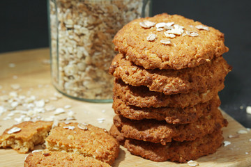 Homemade oatmeal cookie at dark background