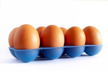 EGG CUP EGGS ON WHITE BACKGROUND
