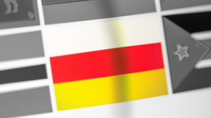 South Ossetia national flag of country. flag on the display, a digital moire effect.