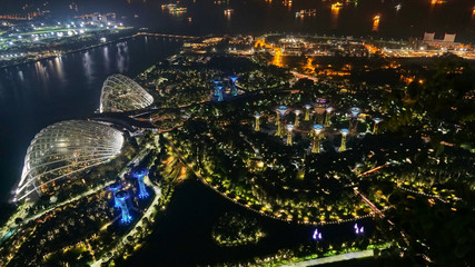 Supertree Grove. Garden by the bay in Marina Bay area in Singapore City. Aerial view at night to...