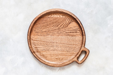 Round Wooden Dish on Grey Background