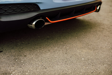 Modern Vehicle Sport Exhaust System. Exhaust End Closeup Photo. sports car 