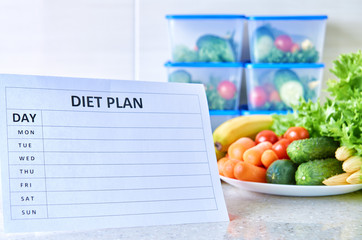 A meal plan for a week on a white table among set of plastic containers for food and food. Proper nutrition during the week.