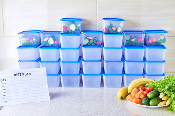 A meal plan for a week on a white table among set of plastic containers for food and food. Proper nutrition during the week.