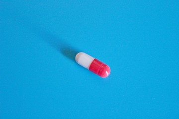 Pharmacology pills on blue background