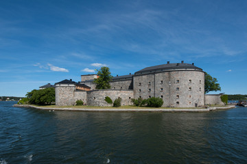 The pier and fortress at the town Vaxholm in Stockholm archhipelago a summer day