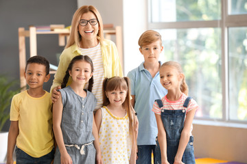 Female teacher with children in primary school