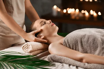 Rolgordijnen Young woman having massage in spa salon © Pixel-Shot