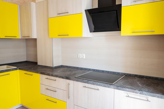 New kitchen set. Bleached oak and yellow inserts. Modern design. Concept design and kitchen design. Bright colours.