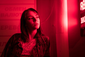 Cinematic night portrait of girl and neon lights