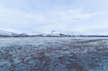Snow capped mountain range on a cloudy morning in Oregon, USA