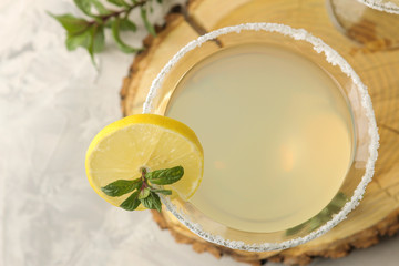 Margarita cocktail, Alcoholic drink, Margarita cocktail with lemon and mint and salt on a bright table. bar. bar stock and accessories. top view