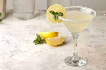 Margarita cocktail, Alcoholic drink, Margarita cocktail with lemon and mint on a bright table. bar....