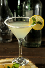 Margarita cocktail, Alcoholic drink, margarita cocktail with lemon and mint and salt on a wooden table. bar. bar stock and accessories.