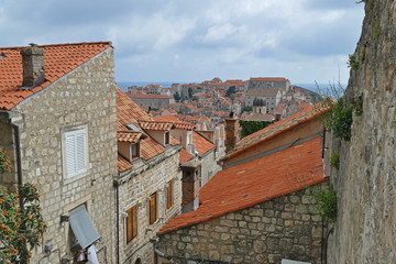 Fototapeta na wymiar Panoramic view from Dubrovnik City Walls, old historic stone houses, Croatia