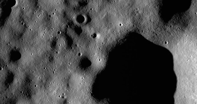 Medium-altitude overflight aerial of rolling terrain NNE of Chaplygin Crater. LAT -1.73 LONG 149.15. Clip loops and is reversible. Elements of this image furnished by NASA