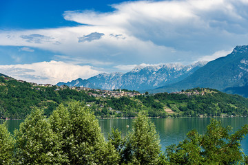 Fototapeta na wymiar Caldonazzo lake (Lago di Caldonazzo) with the Alps and small village of Tenna, Valsugana valley, Trento province, Trentino Alto Adige, Italy, Europe
