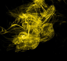 Yellow smoke on black background