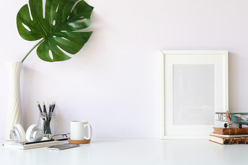 Mockup workspace desk and copy space books,plant and coffee on white desk.