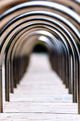 A view through the middle of a stainless steel bike rack