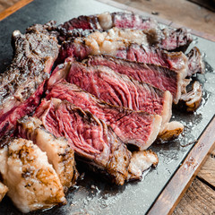 Grilled Australian Tomahawk on Black Plate