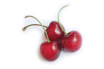 Ripe fresh cherries isolated on white background