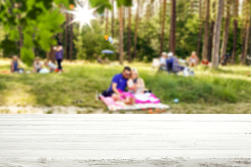 Desk of free space and summer garden background 