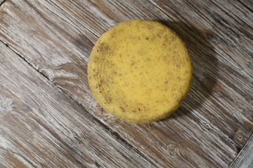 Delicious cacotta cheese which is needed drink with wine on a beautiful wooden background