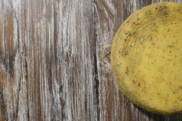 Delicious cacotta cheese which is needed drink with wine on a beautiful wooden background