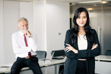 Asian business women and group using notebook for meeting and business women smiling happy for working
