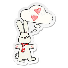 cartoon rabbit in love and thought bubble as a distressed worn sticker