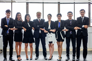 smiling happy Businessman and Businesswomen celebrating success Achievement Arm Raised and show thumb up Concept