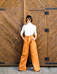 Woman attractive brunette wear fashionable clothes. Femininity and emphasize feminine figure. Girl...
