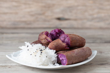 Steamed purple sweet potato in white plate