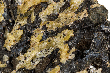 Macro of a mineral stone Vesuvianite on a white background