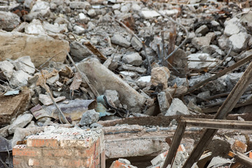 Brick wall and pieces of a dismantled building