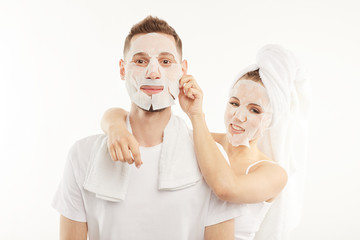 Man and woman use hygienic face masks.