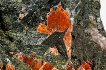 Macro stone mineral Diopside Calcite Magnetite on a white background