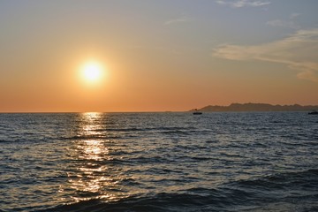 Sunset over Adriatic Sea. View from Golem / Durres, Albania. Beautiful sunset with Durres town silhouette in the distance