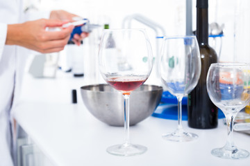 modern laboratory of winery. Checking acidity of wine and organoleptic characteristics