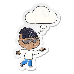 cartoon boy wearing sunglasses pointing and thought bubble as a distressed worn sticker