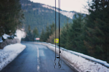 Sunglasses hanging on front bus glass