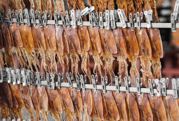 dried squids hang on the rack, Thai beach