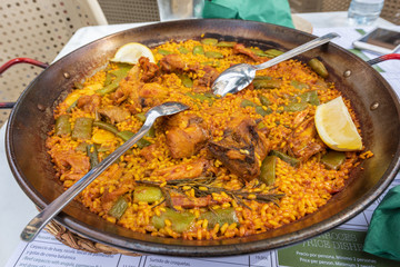 Paella dish in Spainsh restaurants from Valencia