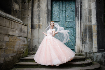 Bride poses near the old church