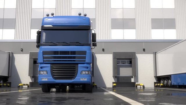 Blue semi trucks loading and unloading goods at warehouse dock. Parallel front view tracking shot. Seamless loop. Realistic high quality 3d animation.